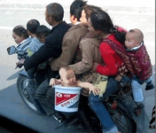 thai-family-on-motorbike.png